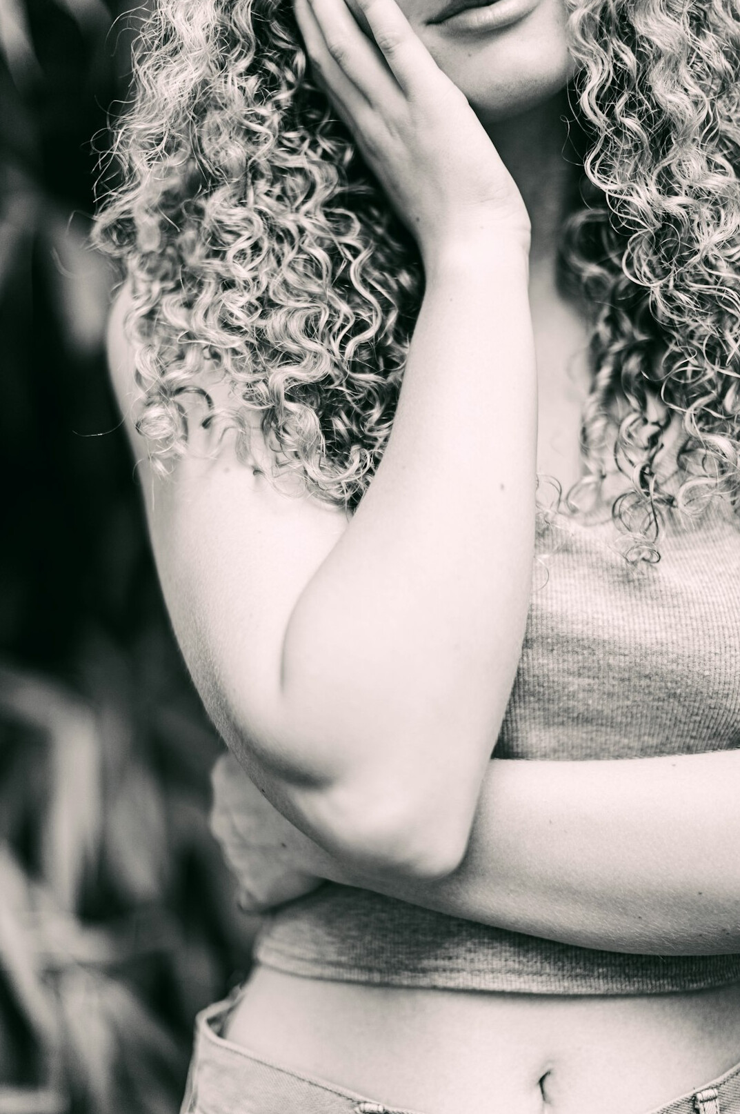 Portrait of a young woman with curly hair