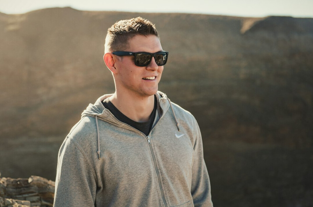 Portrait of a young man smiling outdoors